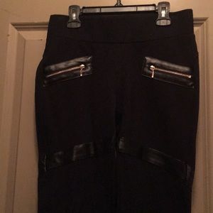 Black jeggings with leather zipper accents